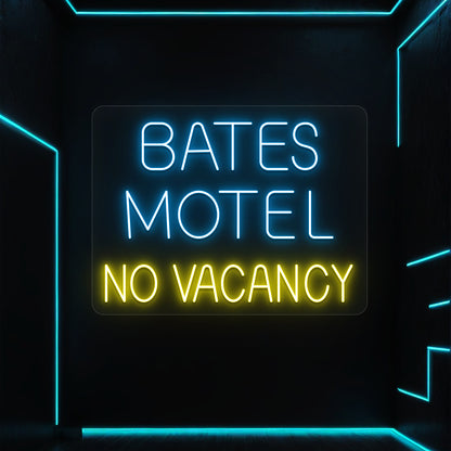ice blue and yellow bates motel no vacancy vintage neon sign mounted on a wall