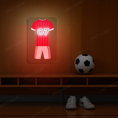 Red pinstriped football jersey neon artwork with number 07 glowing on a wooden wall