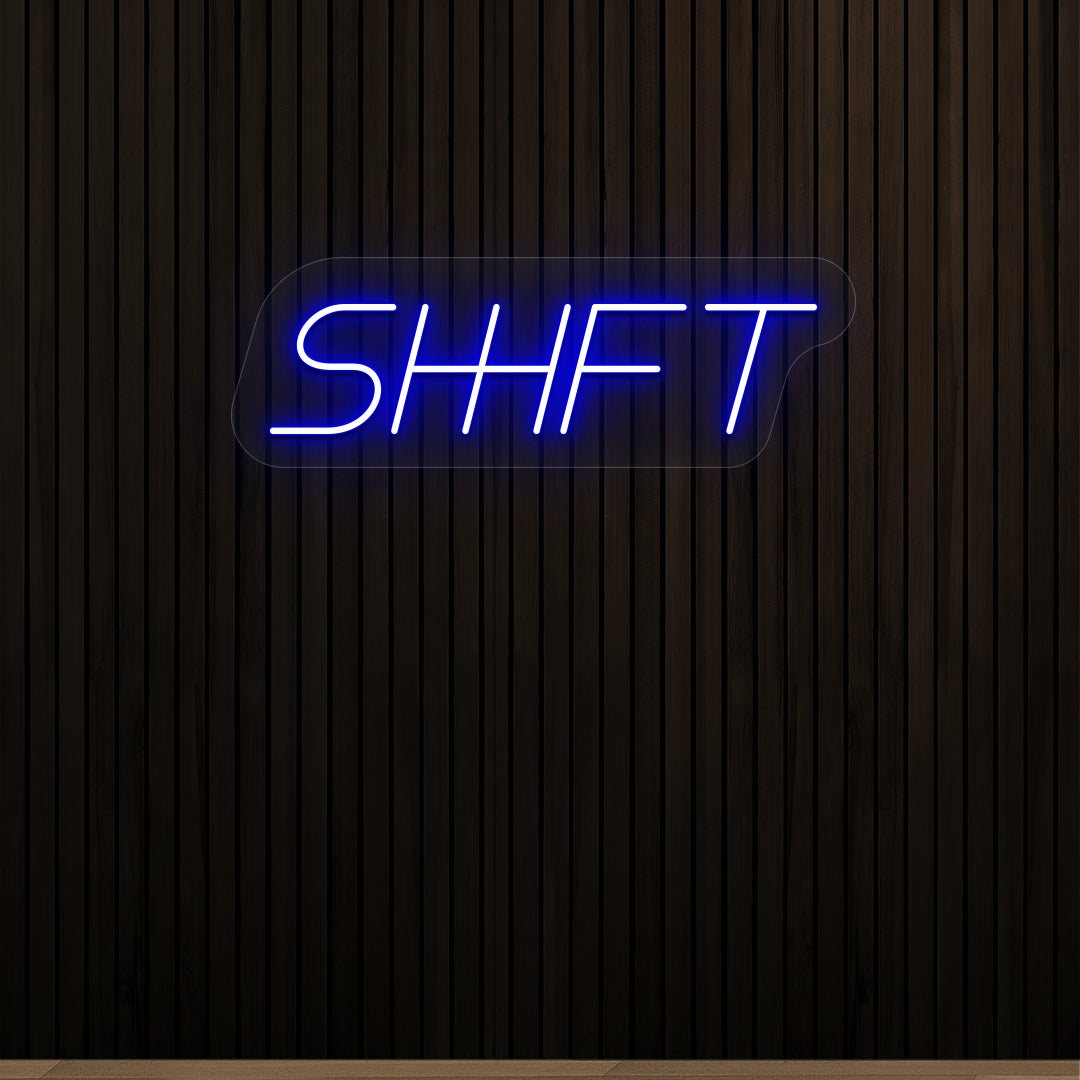 blue shift vintage neon sign mounted on a wall