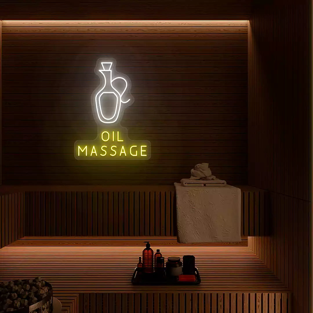 Oil Massage neon sign in white and yellow colors glowing on a wooden wall