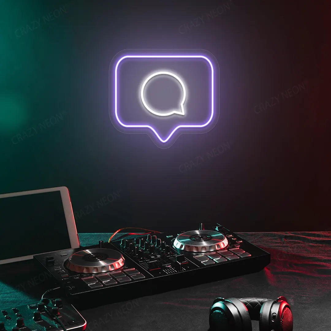 Comment Box Neon Sign in Purple Color Mounted on a wall 