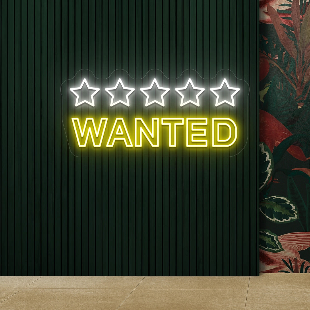 yellow and white five star wanted vintage neon sign mounted on a wall