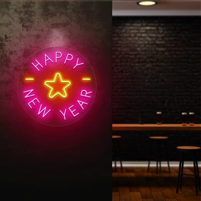 Round Happy New Year neon sign with pink and yellow star design glowing on a dark wall