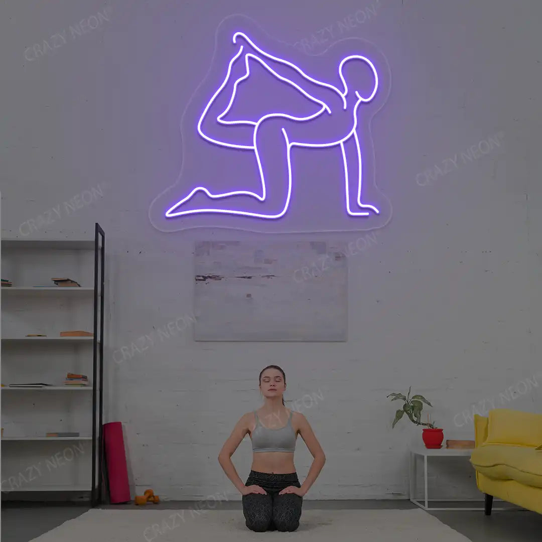 Eka Hasta Vyaghrasana Yoga Neon Sign glowing in purple color in a yoga room