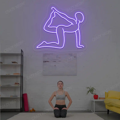 Eka Hasta Vyaghrasana Yoga Neon Sign glowing in purple color in a yoga room