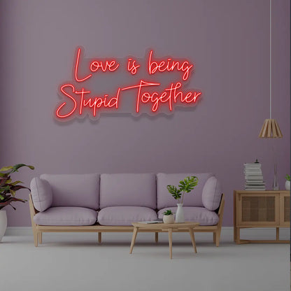Love Is Being Stupid Together Neon Sign in Red Color 