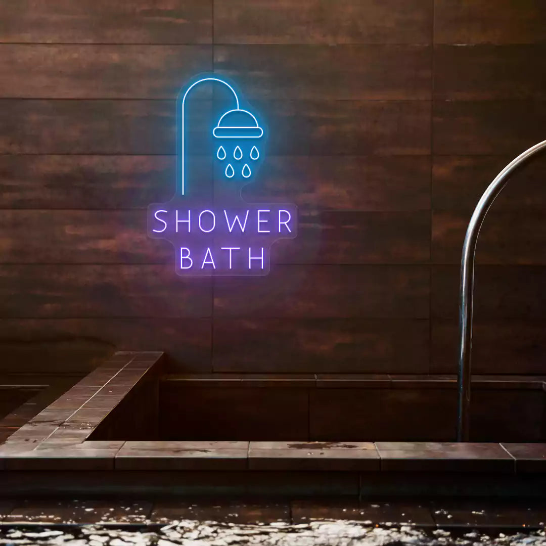 Shower Bath neon sign in ice blue and purple colors glowing on a wooden wall