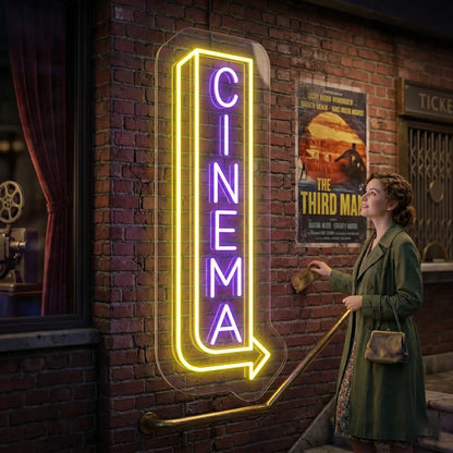 purple and yellow midnight cinema vintage neon sign mounted on a wall