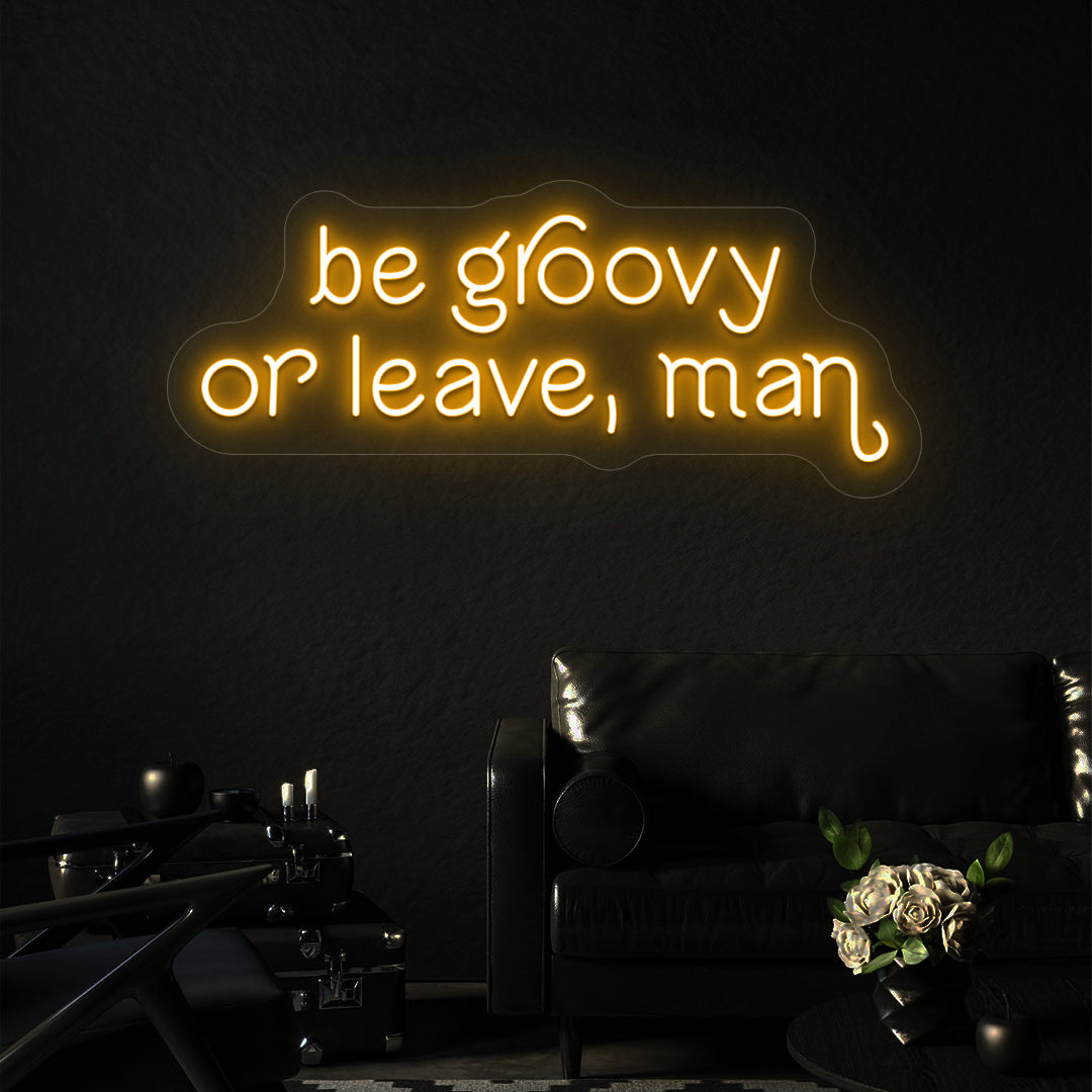 orange be groovy or leave, man vintage neon sign mounted on a wall