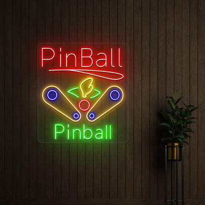 Multi color pinball wizard vintage neon sign mounted on a wall