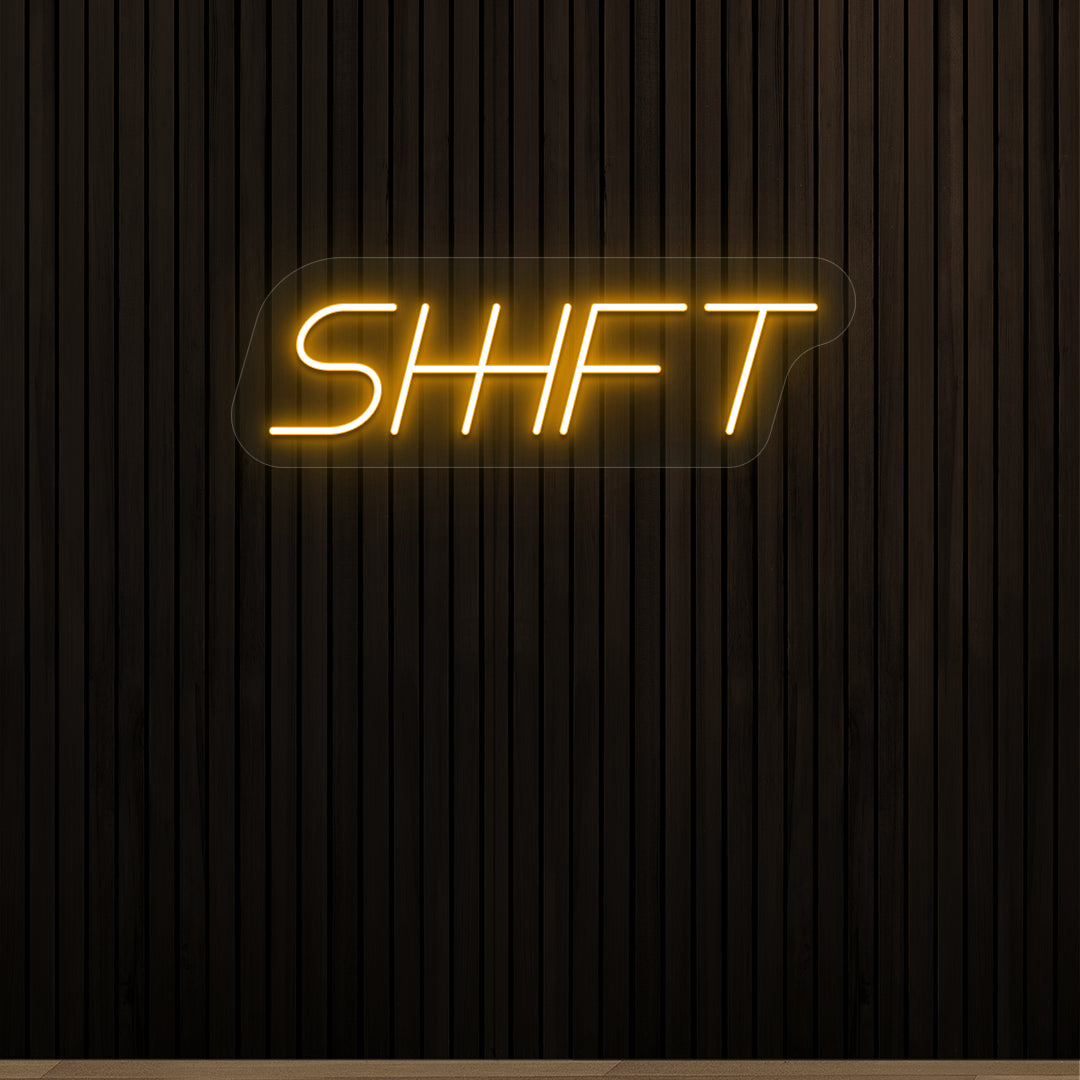 orange shift vintage neon sign mounted on a wall