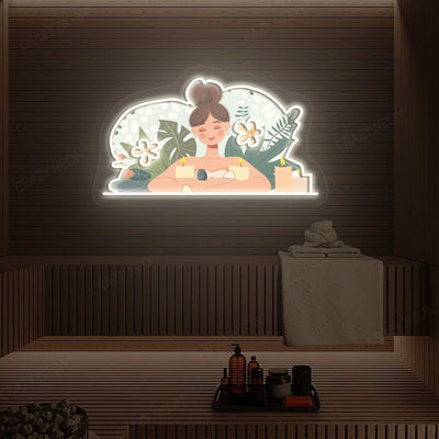 Aromatherapy Relaxation Neon Artwork lighting up in warm white color on a wooden spa wall
