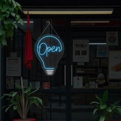 ice blue bulb open neon sign hanging on a window