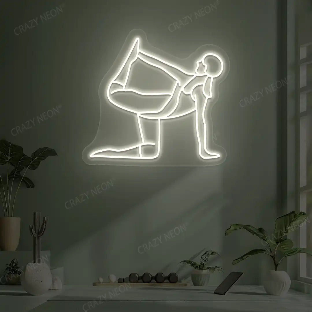 Ardha Dhanurasana Yoga Neon Sign glowing in warm white color in a yoga room