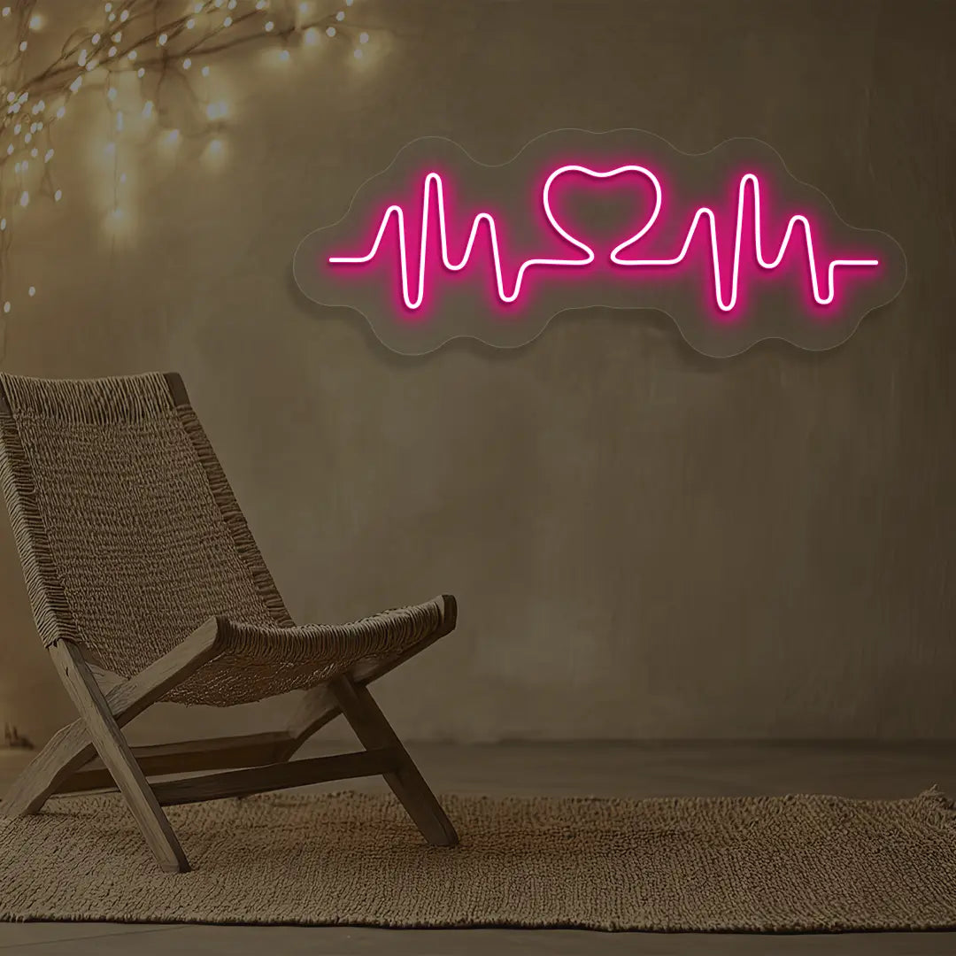 pink love pulse neon sign mounted on a wall