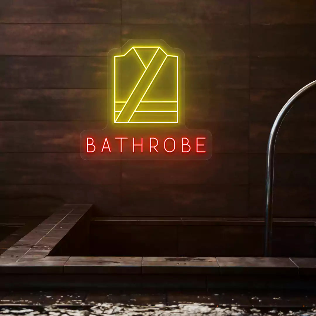 Golden Bathrobe neon sign in yellow and red colors glowing on a wooden wall