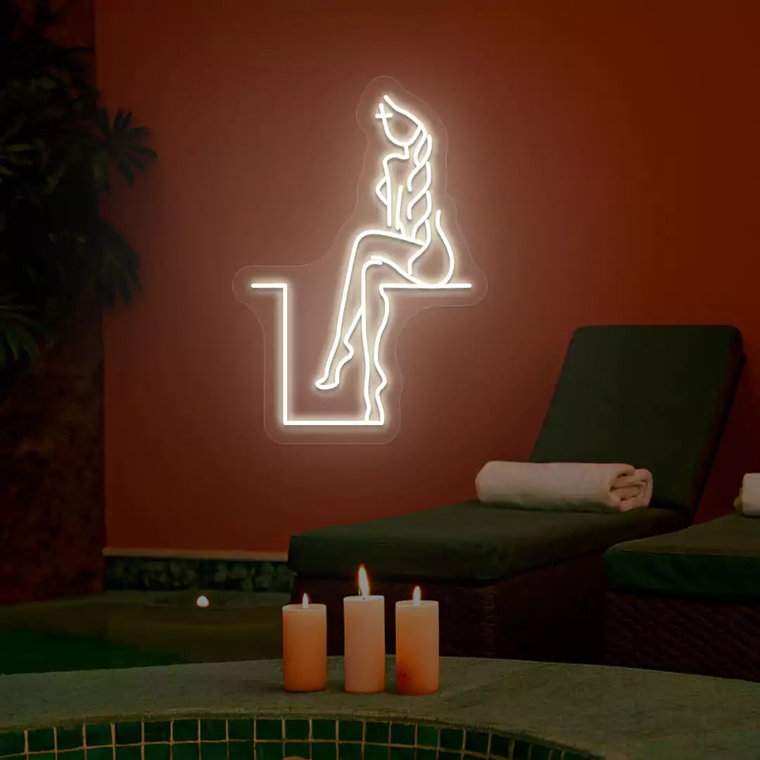 Warm white Tranquil Lounge Spa neon sign glowing on a terracotta wall