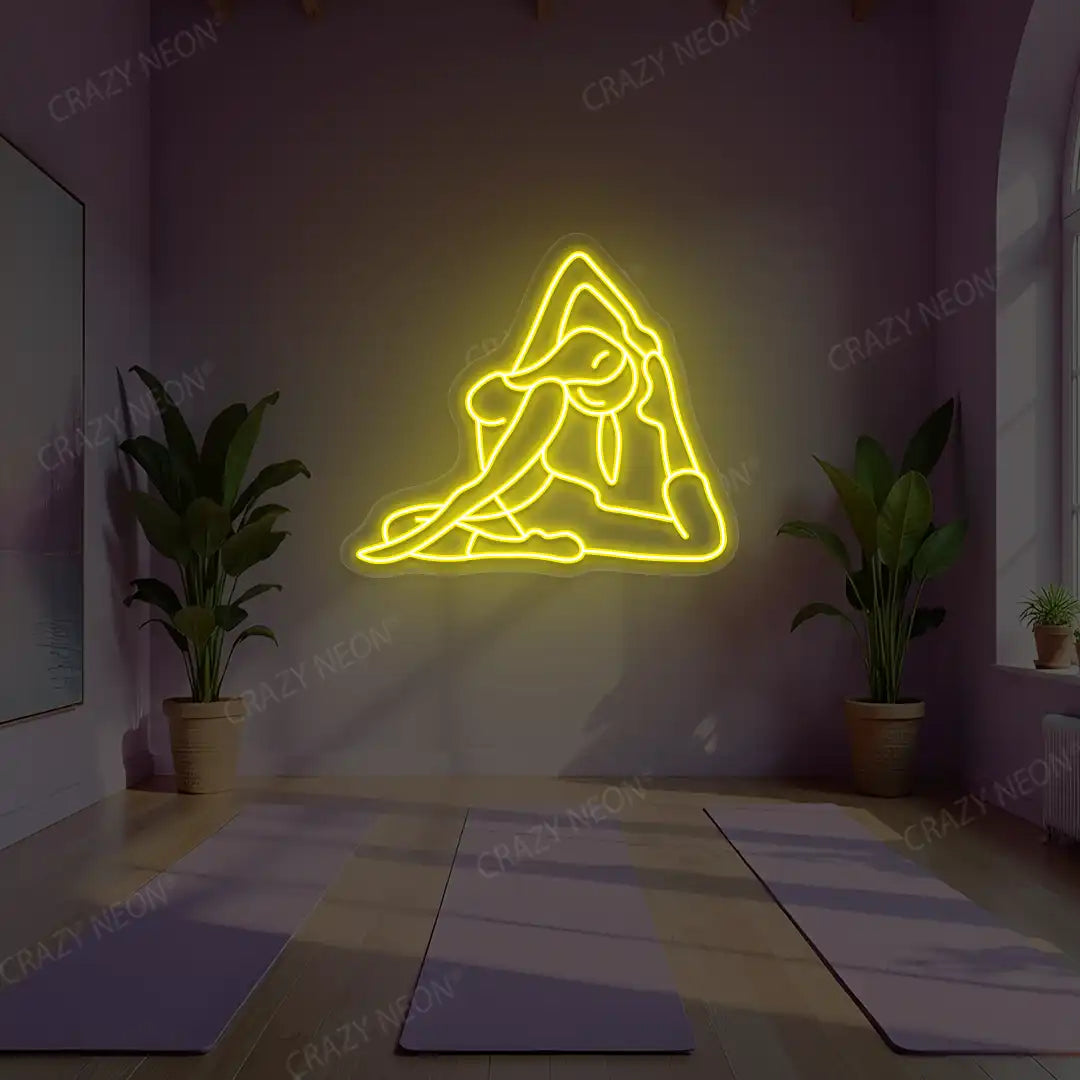 Eka Pada Rajakapotasana Yoga Neon Sign lighting up in yellow color in a yoga room