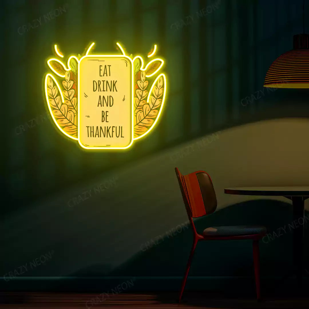 Eat drink and be thankful neon sign in yellow