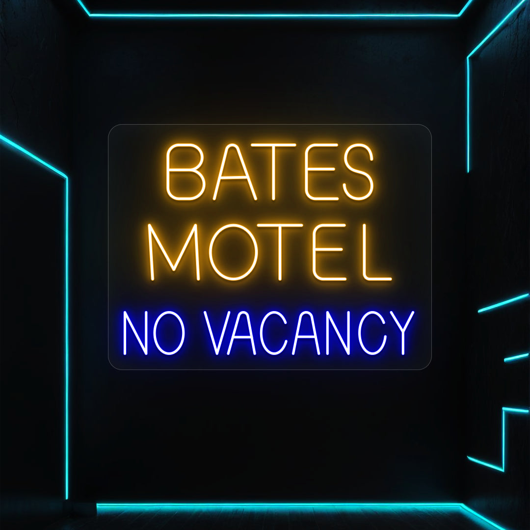 orange and blue bates motel no vacancy vintage neon sign mounted on a wall
