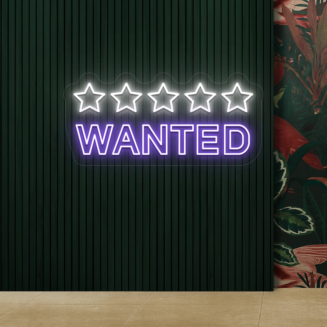 purple and white five star wanted vintage neon sign mounted on a wall