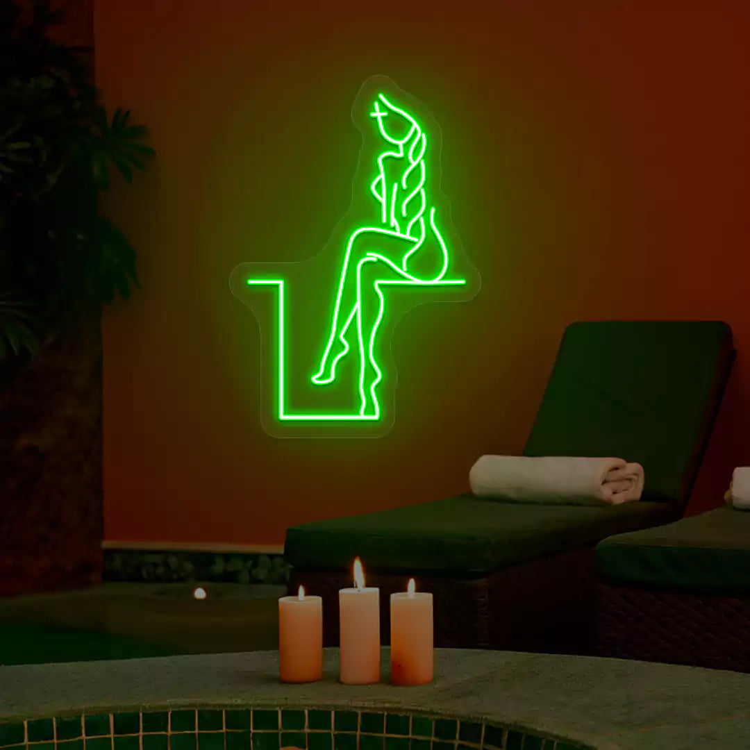 Green Tranquil Lounge Spa neon sign glowing on a terracotta wall
