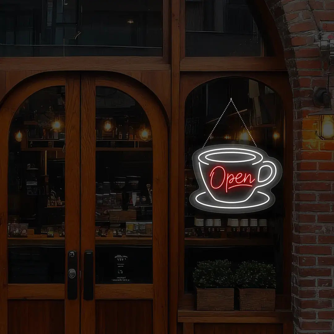 red coffee open neon sign hanging on a window