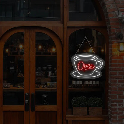 red coffee open neon sign hanging on a window