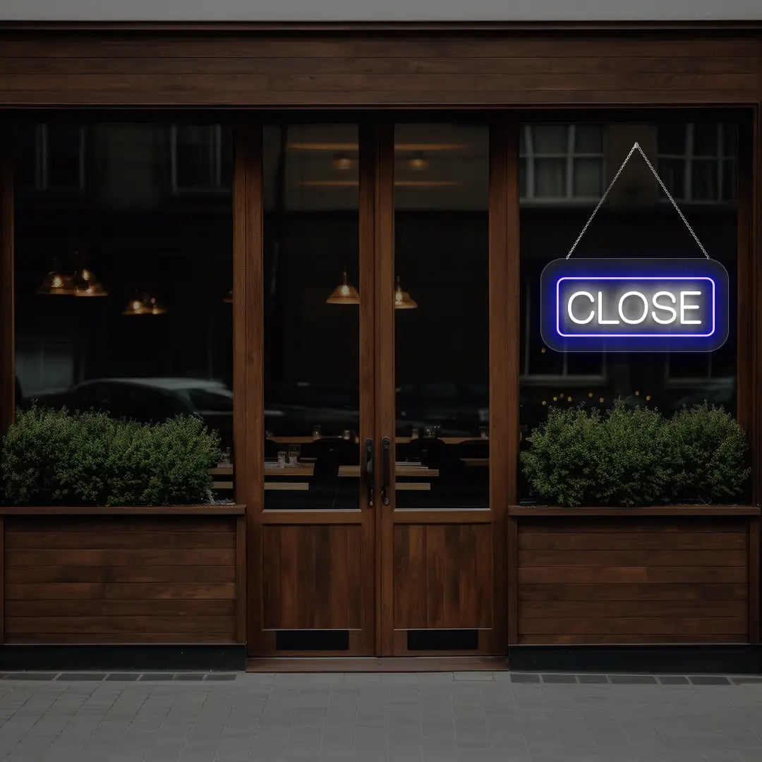 horizontal close neon sign glowing in blue color on a window