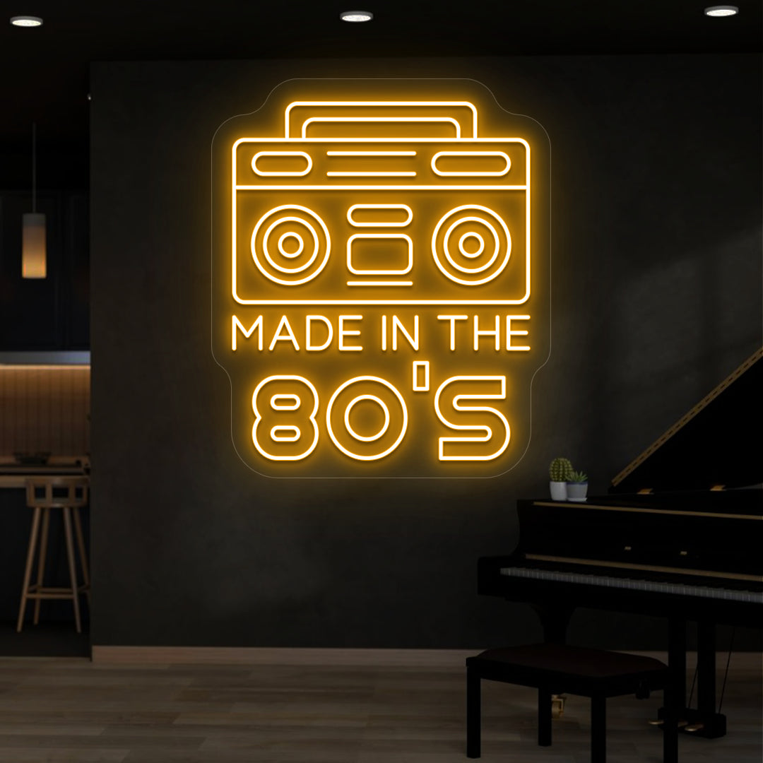 orange made in the 80s stereo vintage neon sign mounted on a wall