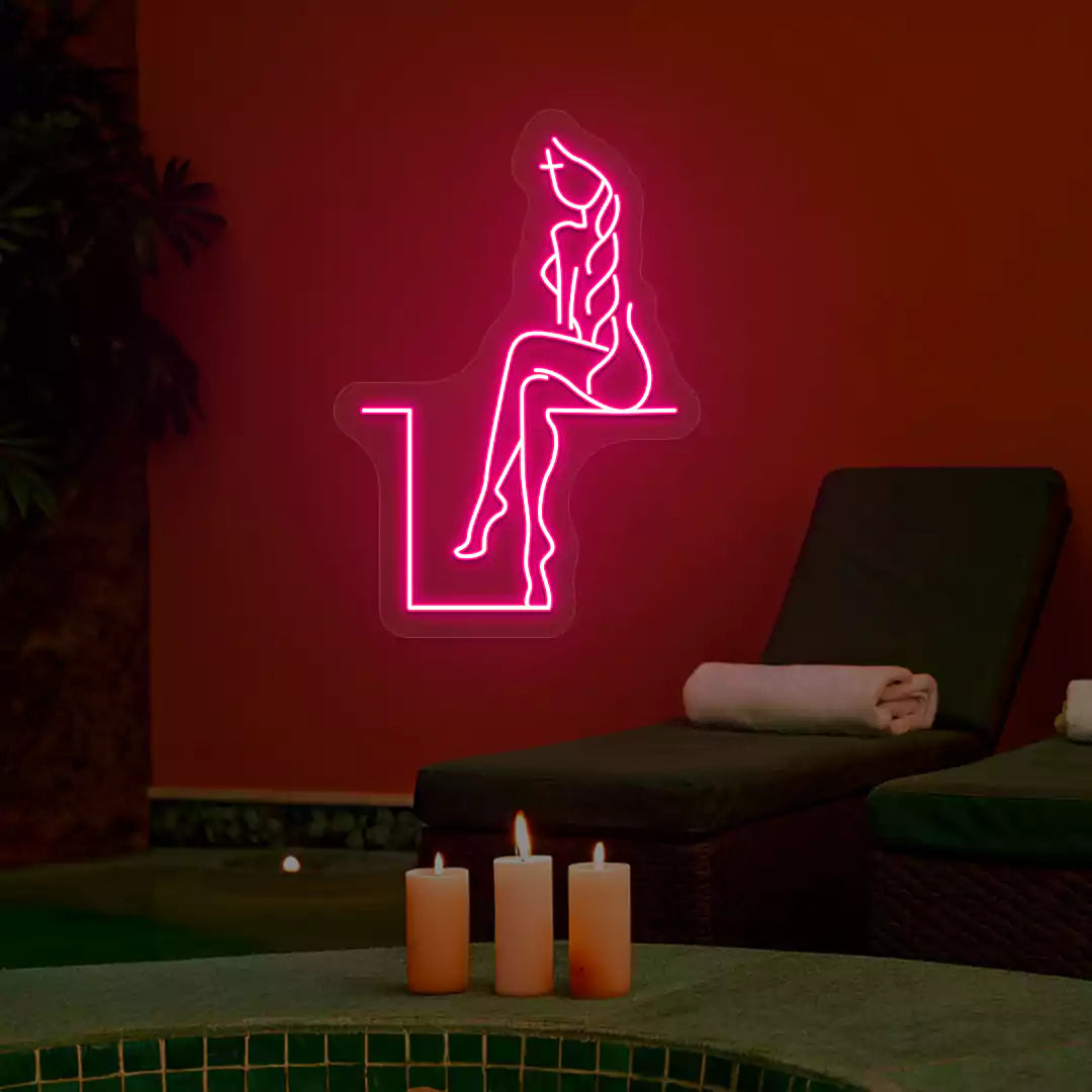 Pink Tranquil Lounge Spa neon sign glowing on a terracotta wall