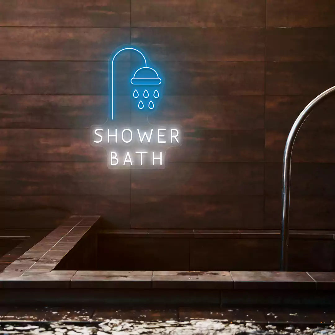 Shower Bath neon sign in ice blue and white colors glowing on a wooden wall