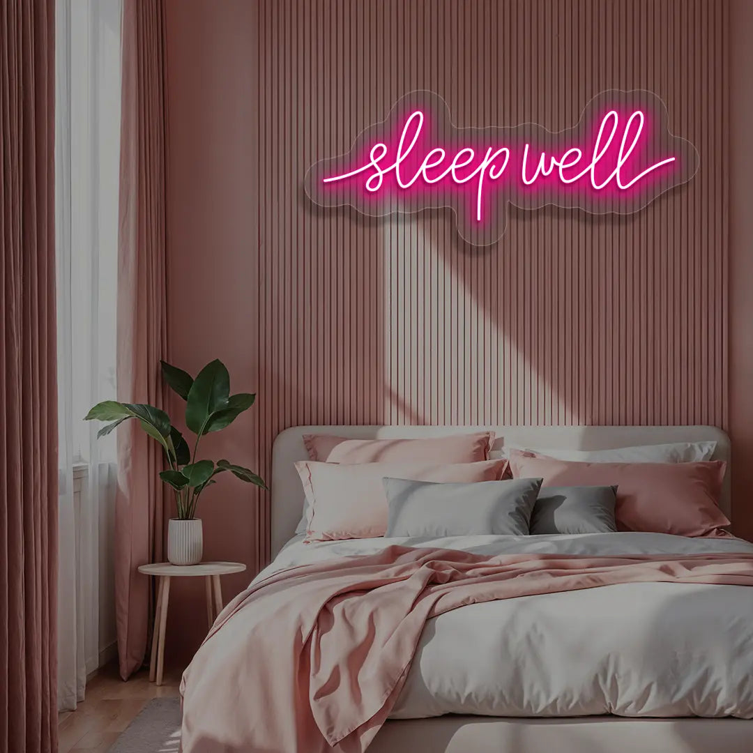 pink sleepwell neon sign mounted on a wall