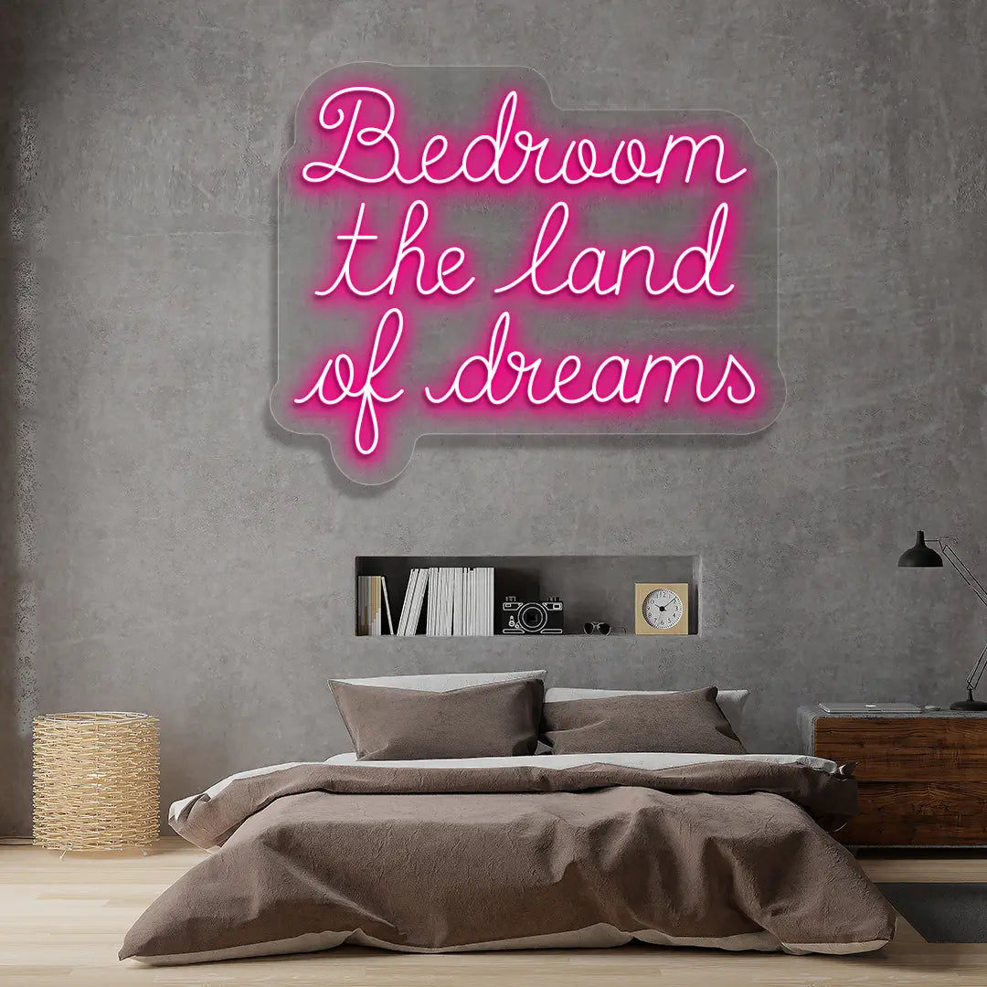 pink bedroom the land of dreams neon sign mounted on a wall