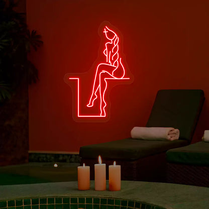 Red Tranquil Lounge Spa neon sign glowing on a terracotta wall