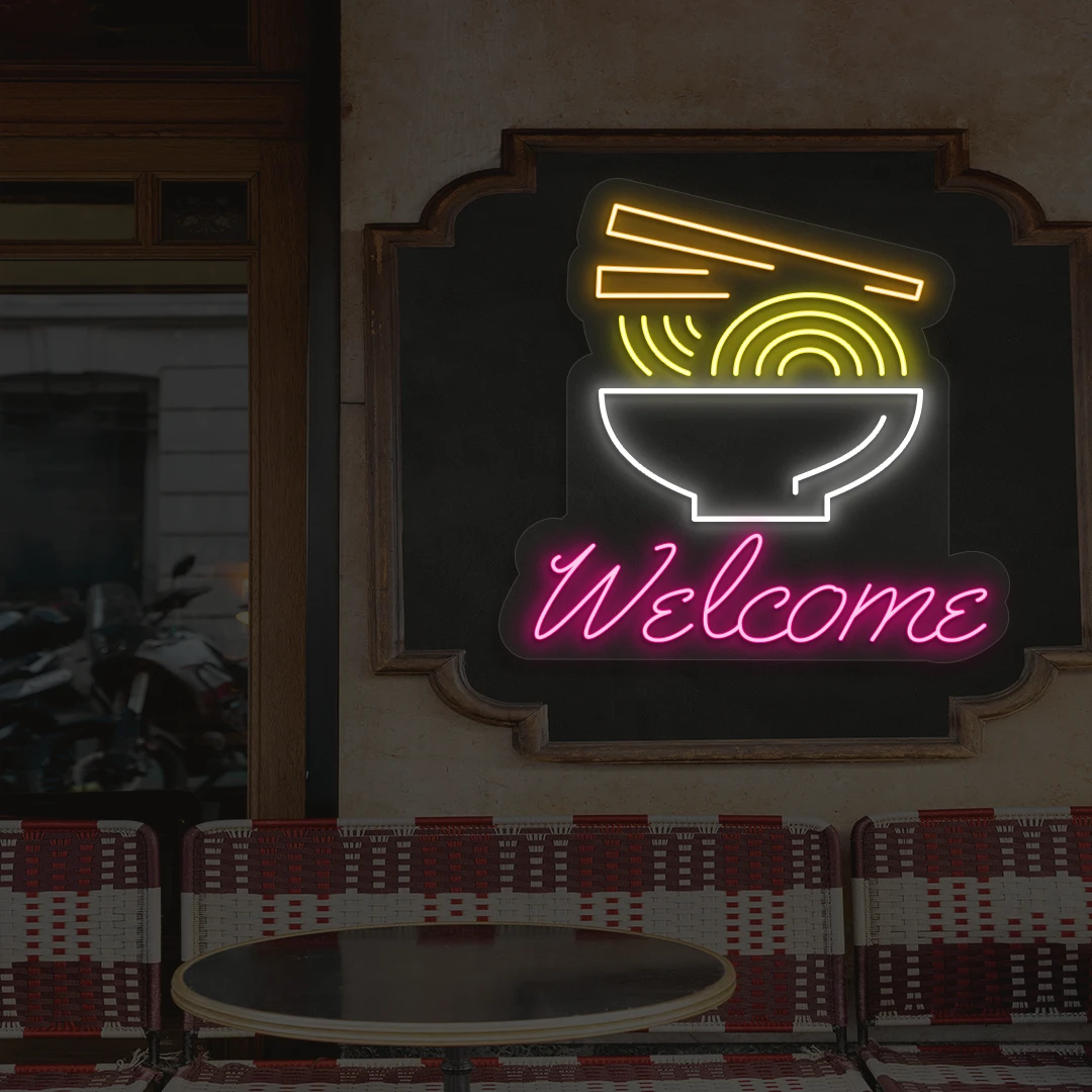 pink white yellow and orange welcome noodle bowl neon sign mounted on a wall