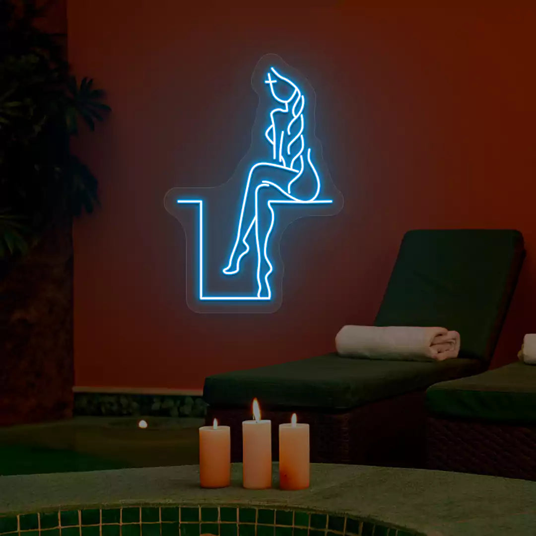 Iceblue Tranquil Lounge Spa neon sign glowing on a terracotta wall