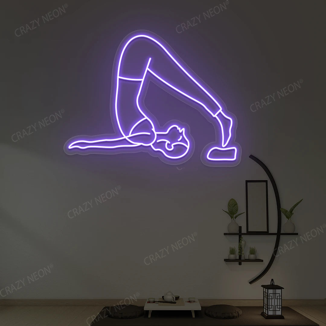 Halasana Yoga Neon Sign glowing in purple color in a yoga room