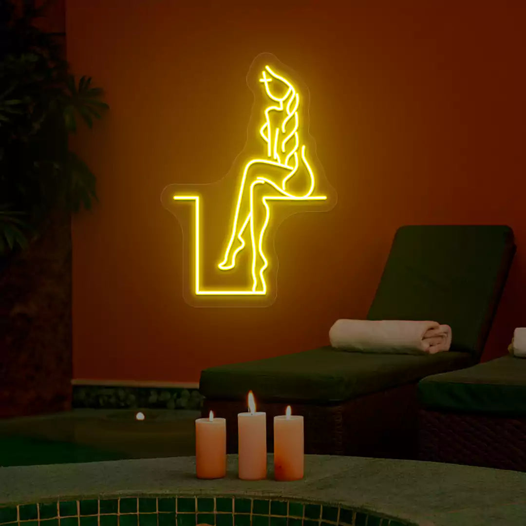Yellow Tranquil Lounge Spa neon sign glowing on a terracotta wall