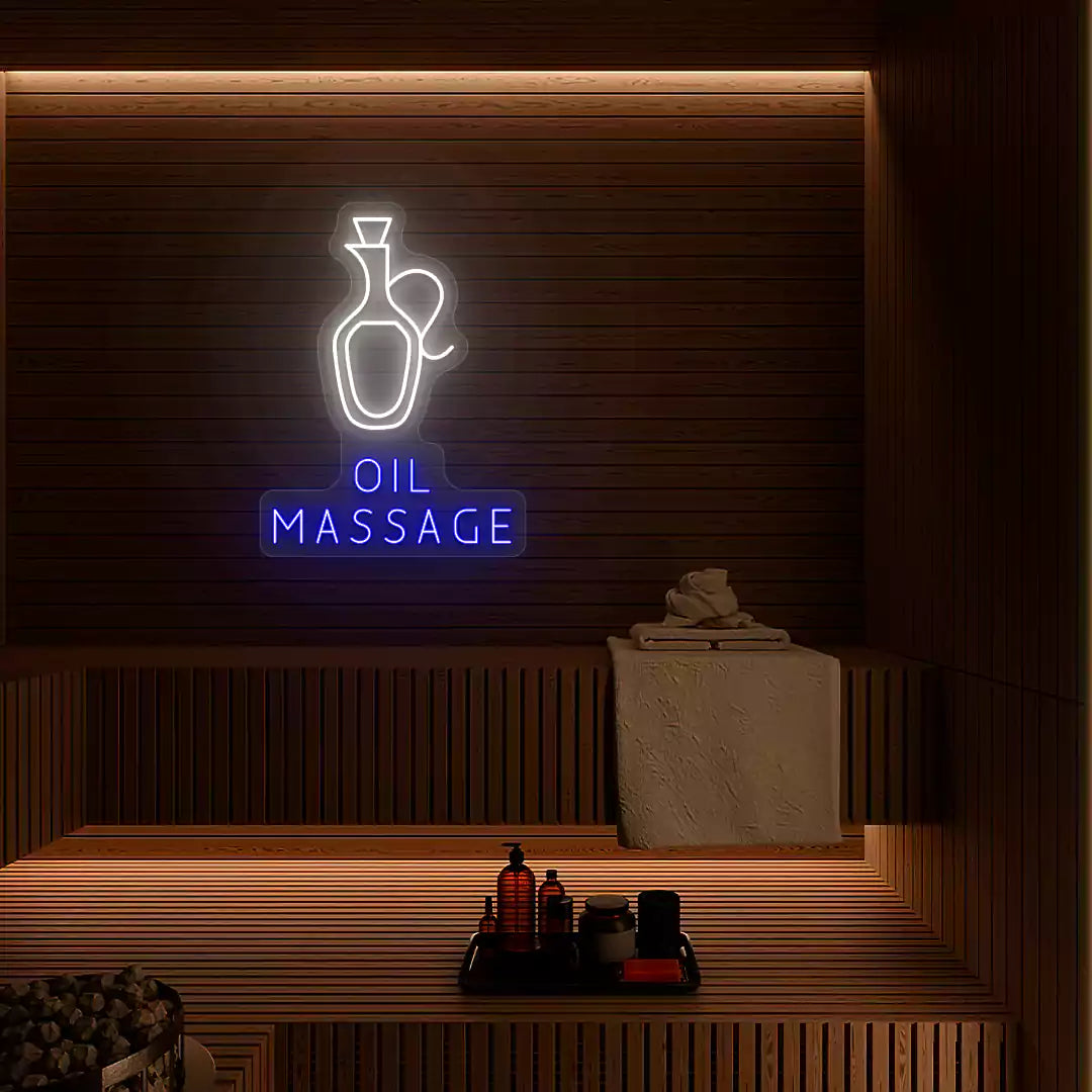 Oil Massage neon sign in white and blue colors glowing on a wooden wall