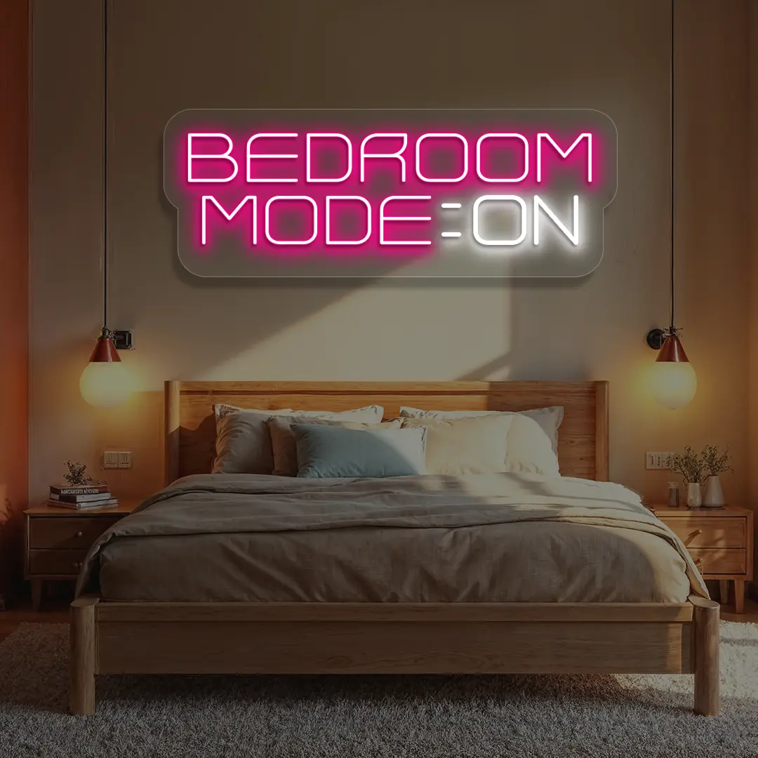 pink and white bedroom mode on neon sign mounted on a wall