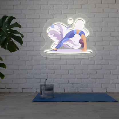 Urdhva Dhanurasana Yoga Neon Artwork lighting up in warm white color in a yoga room
