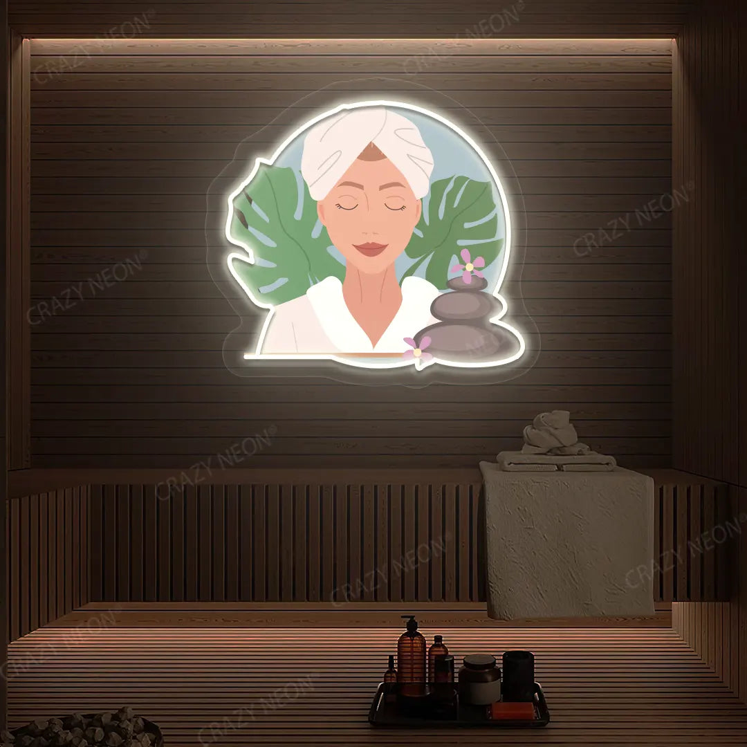 Zen Facial Spa Neon Artwork lighting up in warm white color on a wooden spa wall
