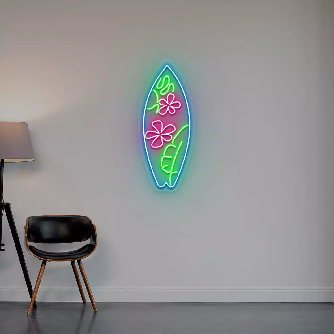 pink green and ice blue flower surfboard neon sign mounted on a wall