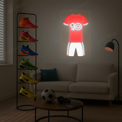 Red football jersey neon artwork with number 10 glowing on a beige wall