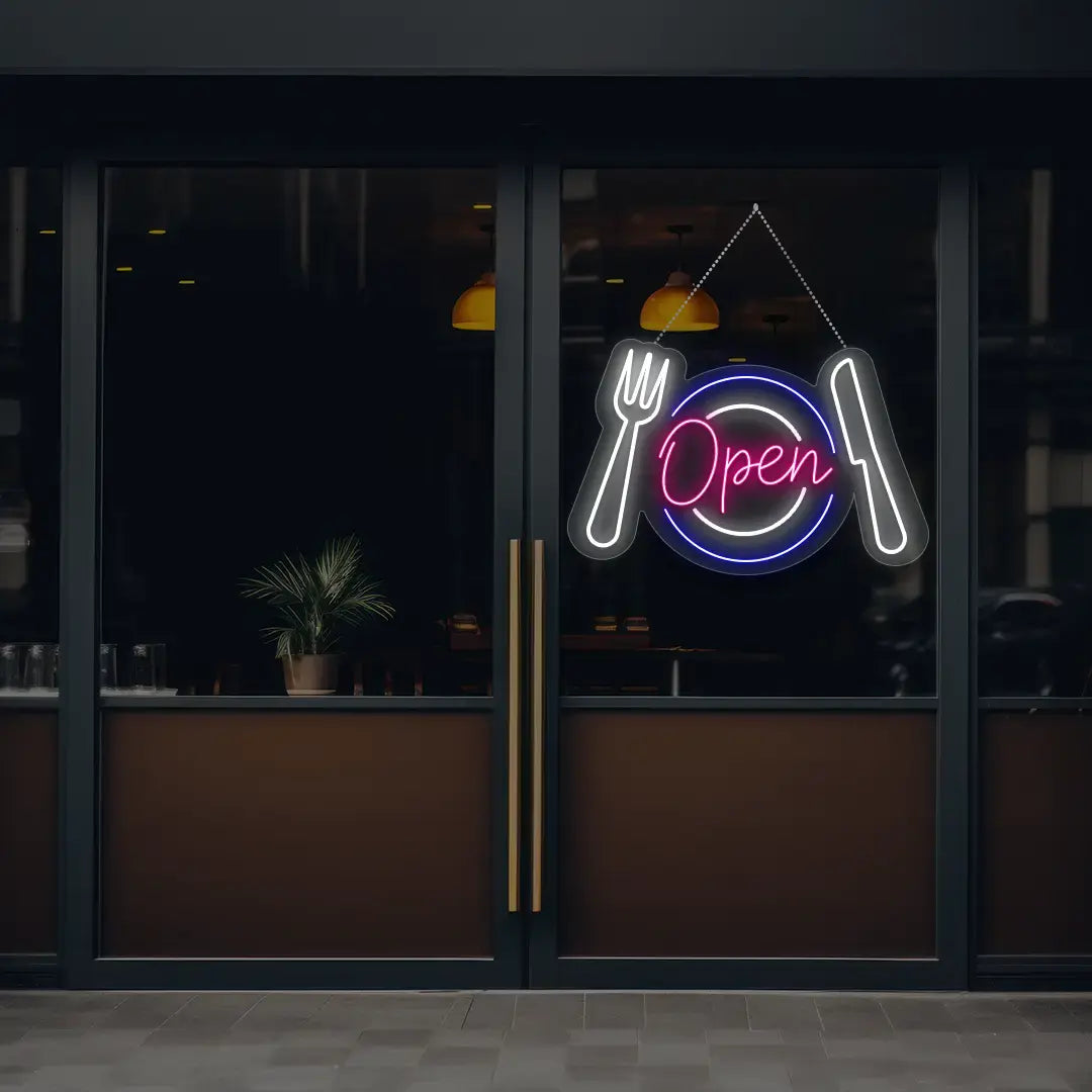 pink diner open neon sign hanging on a window