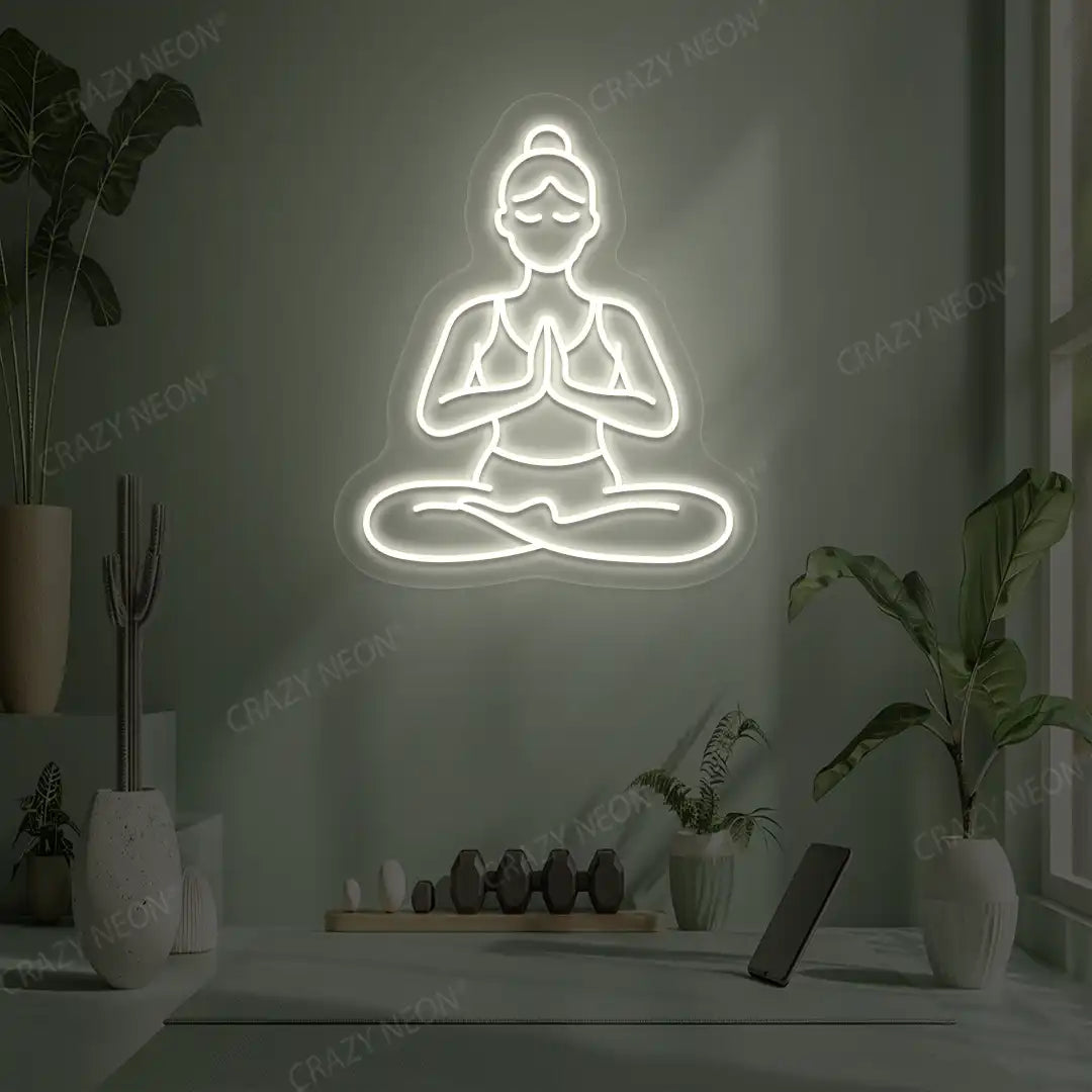 Padmasana Anjali Mudra Yoga Neon Sign lighting up in warm white color in a yoga room