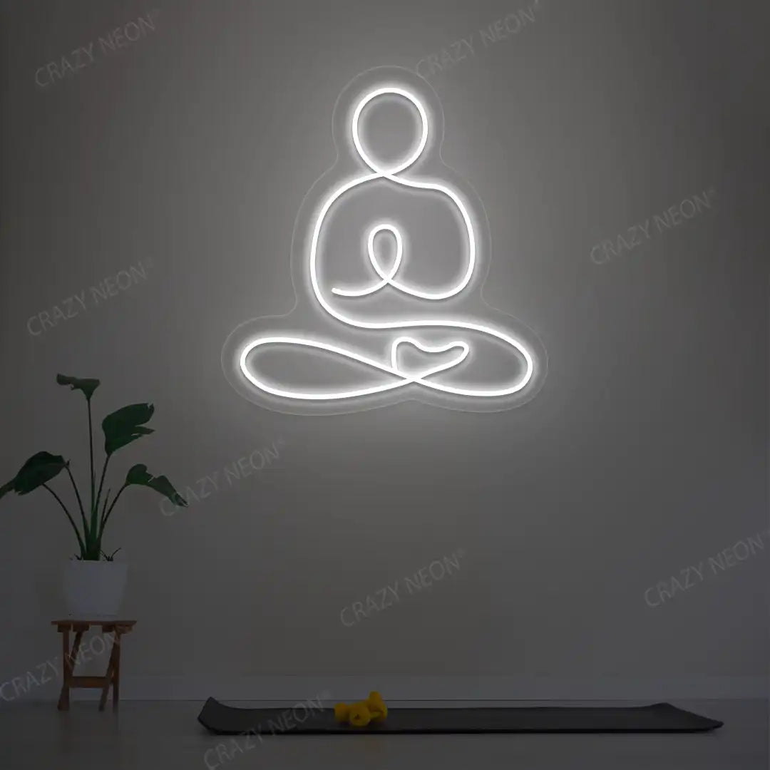 Swastikasana Yoga Neon Sign lighting up in white color in a yoga room