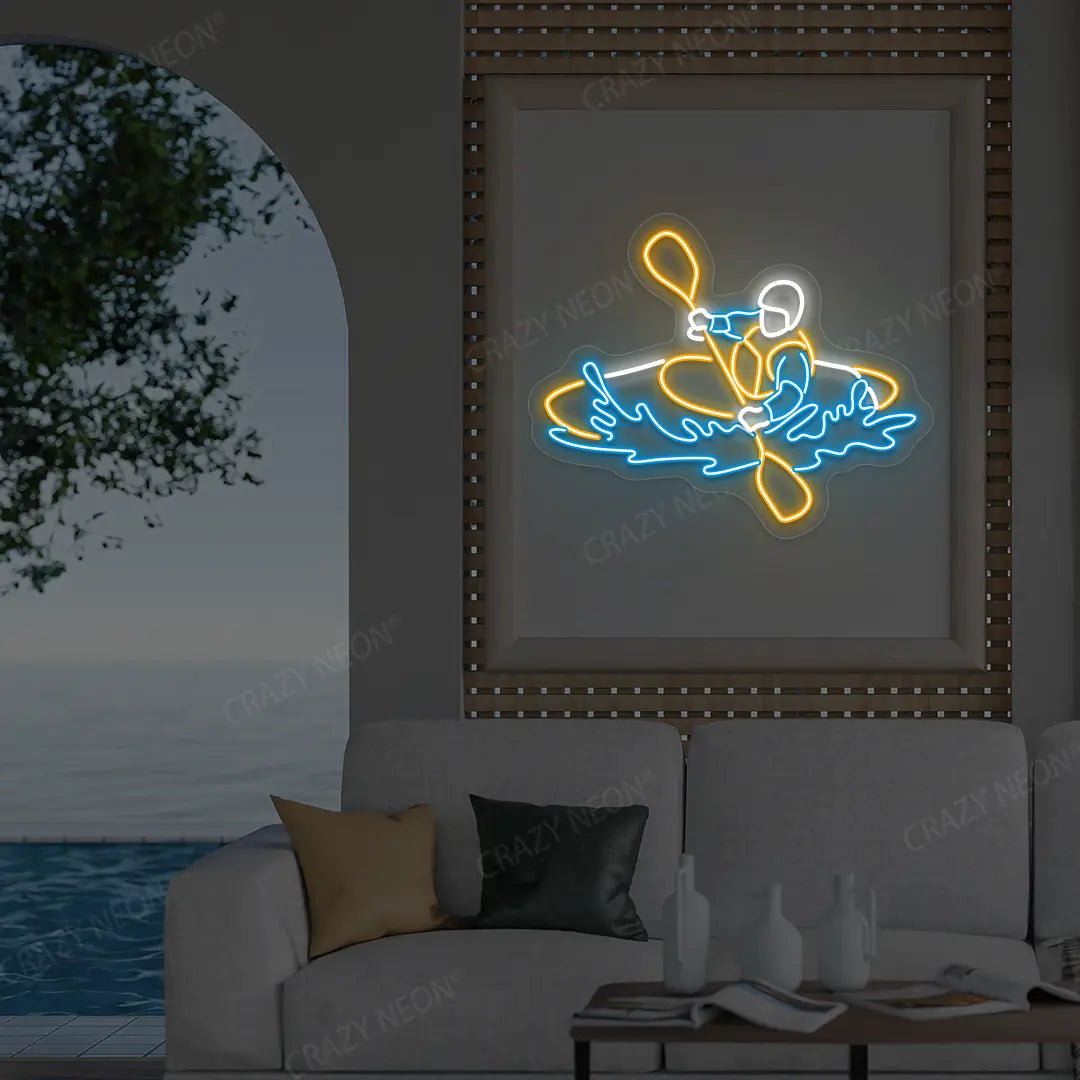 orange white and ice blue water sport kayaker neon sign mounted on a wall