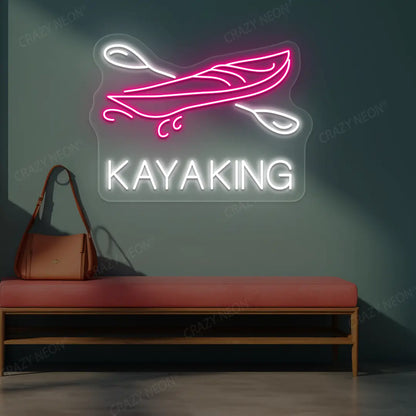 pink and white kayaking boat neon sign mounted on a wall